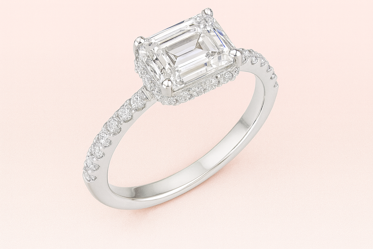 Arabella lab-grown emerald-cut diamond engagement ring in platinum/white gold on dusky pink background.