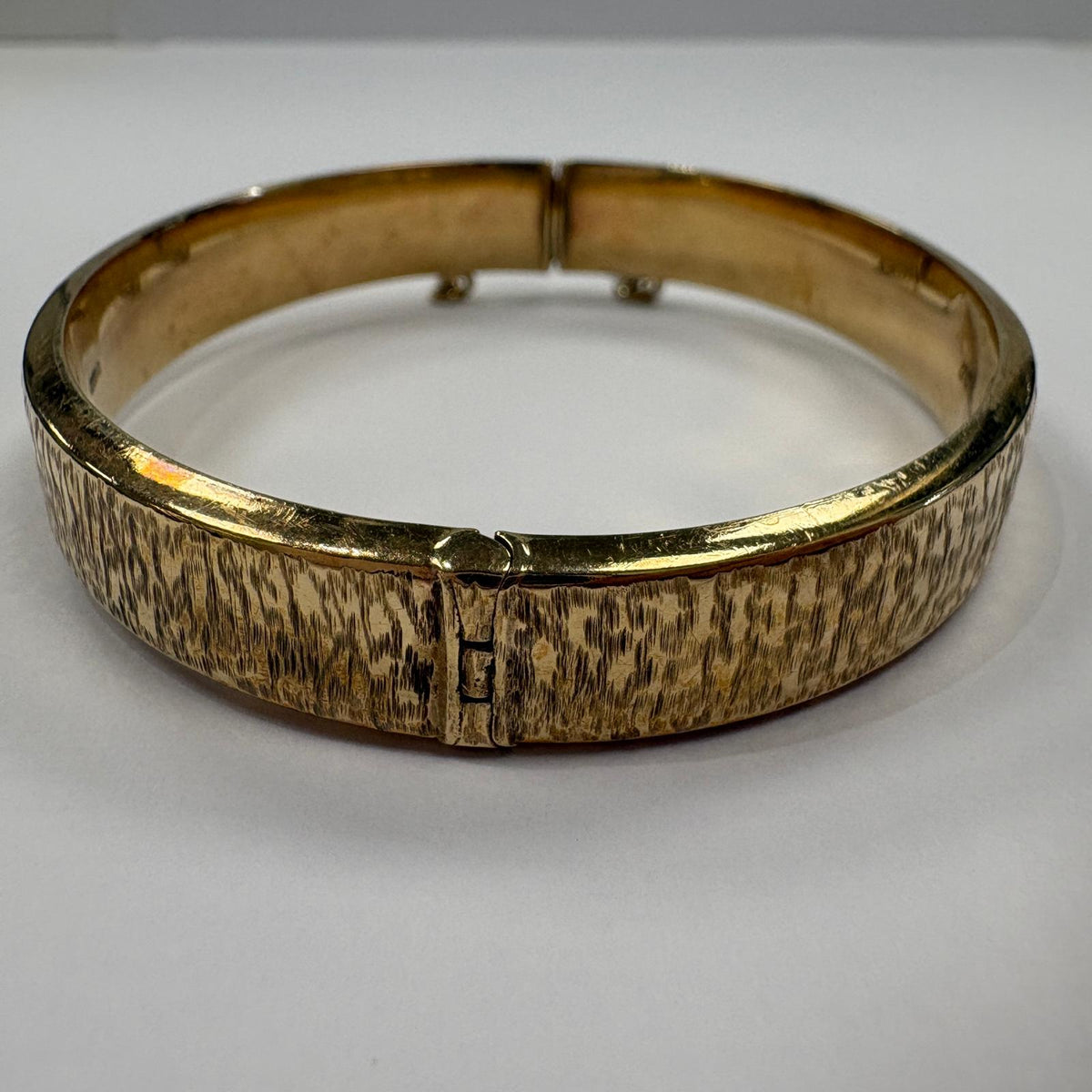 vintage gold bangle UK, bark effect bangle, 1970s gold bangle, 9ct gold hinged bangle, 1973 birth year gift, textured gold bangle, vintage 9ct gold bracelet, gold bangle with safety chain