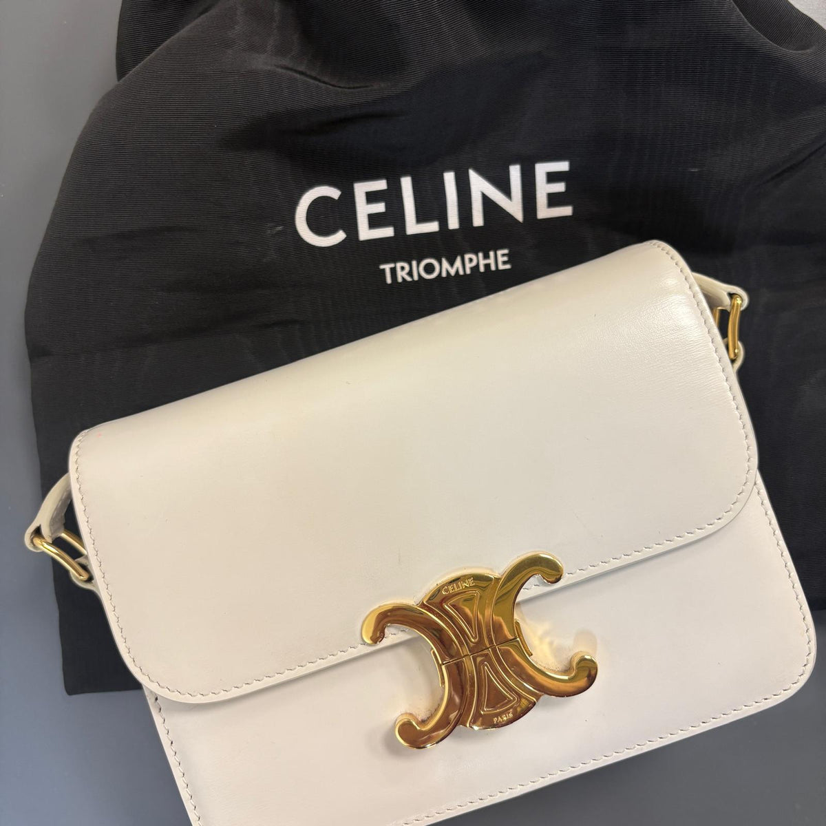 Celine Teen Triomphe, pre-loved Celine bag UK, white Celine Triomphe bag, second hand Celine handbag, Celine Triomphe shoulder bag, Celine crossbody bag, preowned designer handbag UK, Celine shiny calfskin