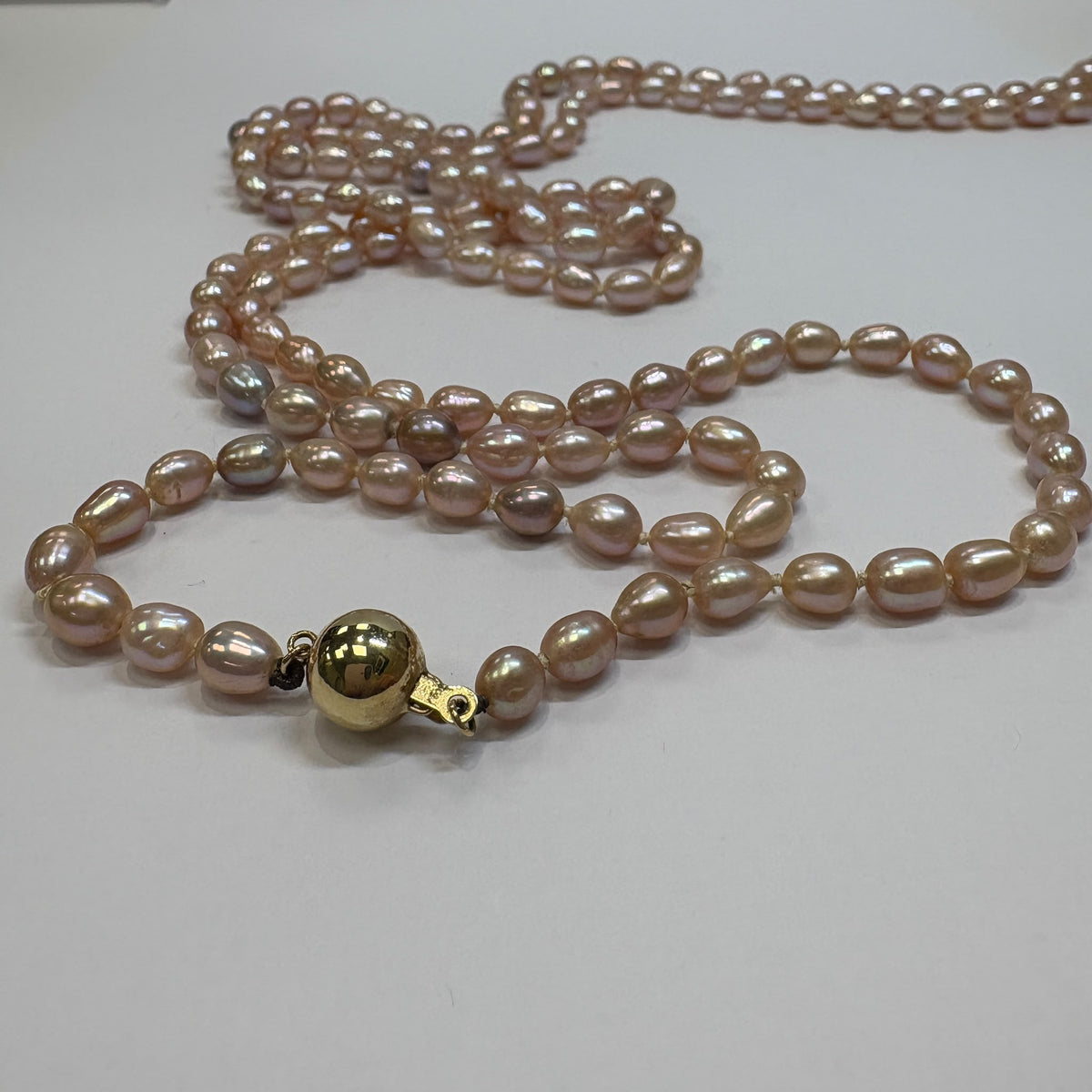 freshwater pearl rope necklace, long pearl necklace UK, blush pearl necklace, opera length pearl necklace, pink pearl necklace, pre-loved pearl necklace, knotted pearl necklace, pearl necklace gold clasp