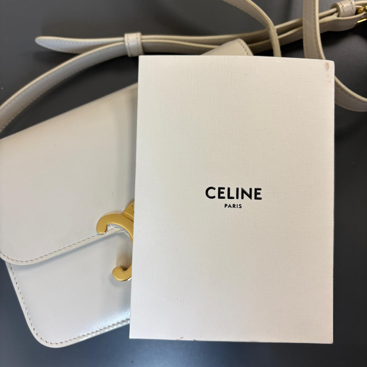 Celine Teen Triomphe, pre-loved Celine bag UK, white Celine Triomphe bag, second hand Celine handbag, Celine Triomphe shoulder bag, Celine crossbody bag, preowned designer handbag UK, Celine shiny calfskin