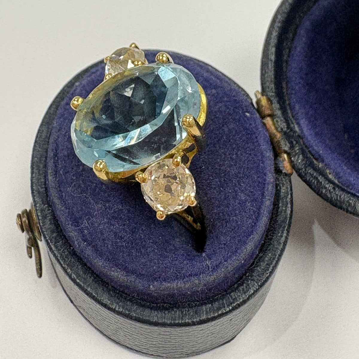 aquamarine engagement ring, old mine cut diamond ring UK, aquamarine and diamond ring, three stone aquamarine ring, alternative engagement ring, antique diamond ring, March birthstone ring, 18ct gold aquamarine ring