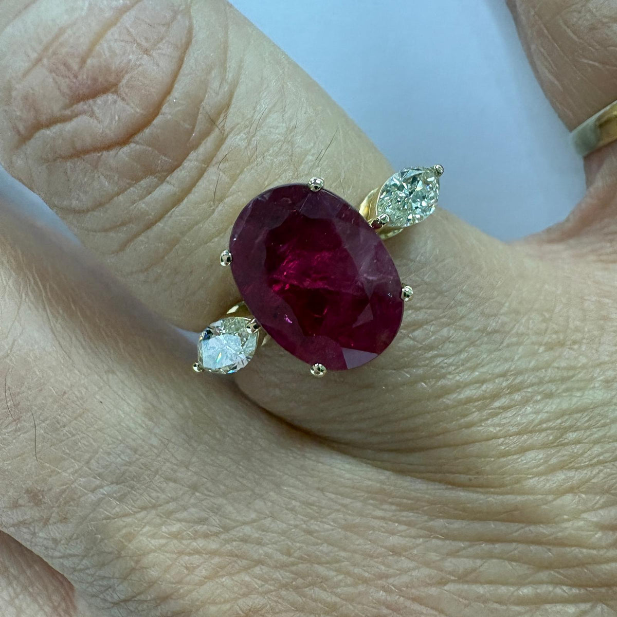 ruby and diamond ring, 3 carat ruby ring, oval ruby ring UK, marquise diamond ring, east west marquise ring, ruby engagement ring, ruby anniversary ring, 18ct gold ruby ring