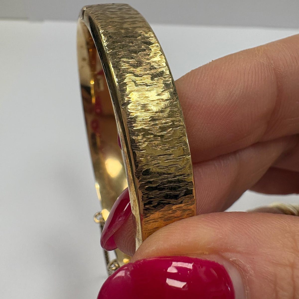 vintage gold bangle UK, bark effect bangle, 1970s gold bangle, 9ct gold hinged bangle, 1973 birth year gift, textured gold bangle, vintage 9ct gold bracelet, gold bangle with safety chain