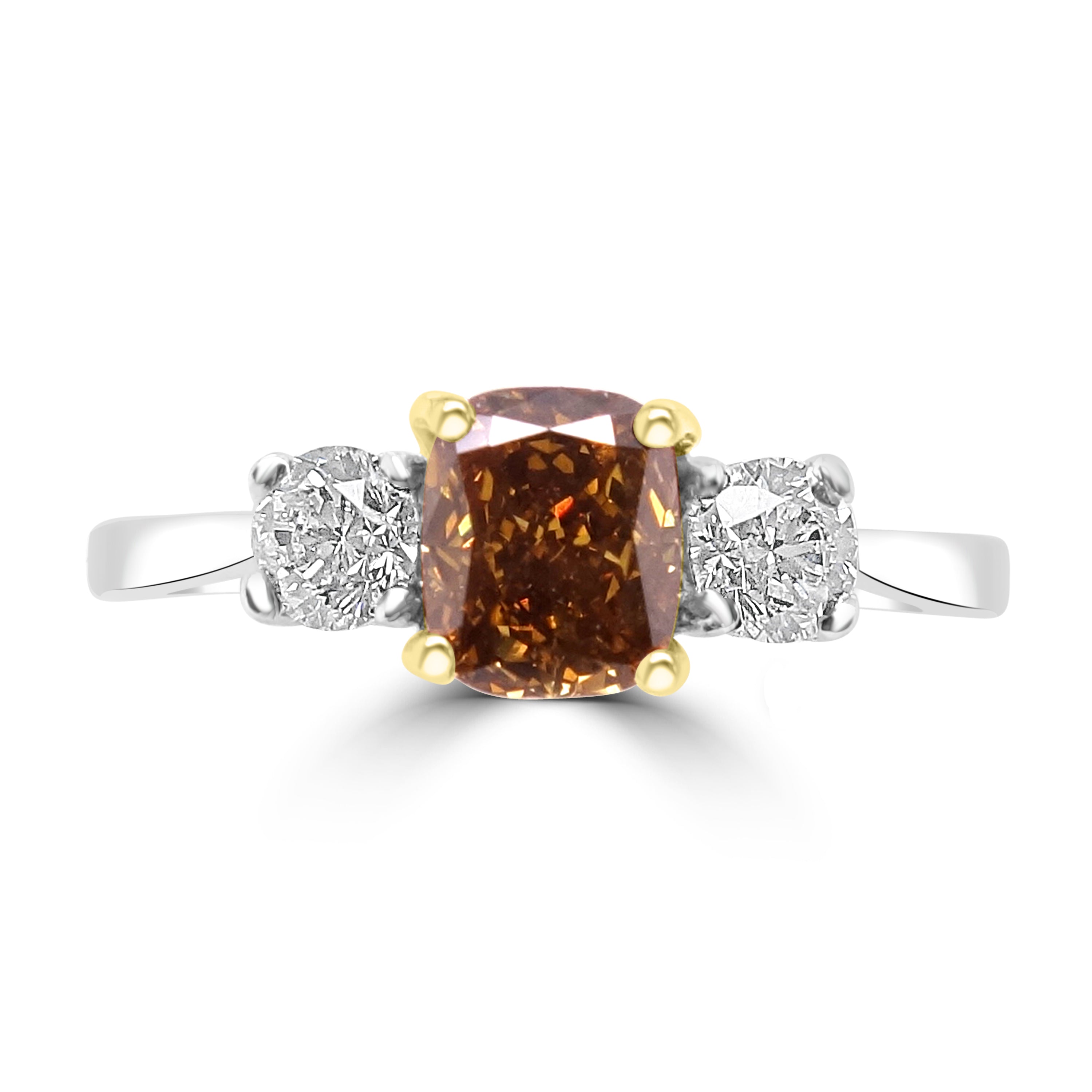 Cushion cut fancy yellow diamond three-stone ring platinum and yellow gold