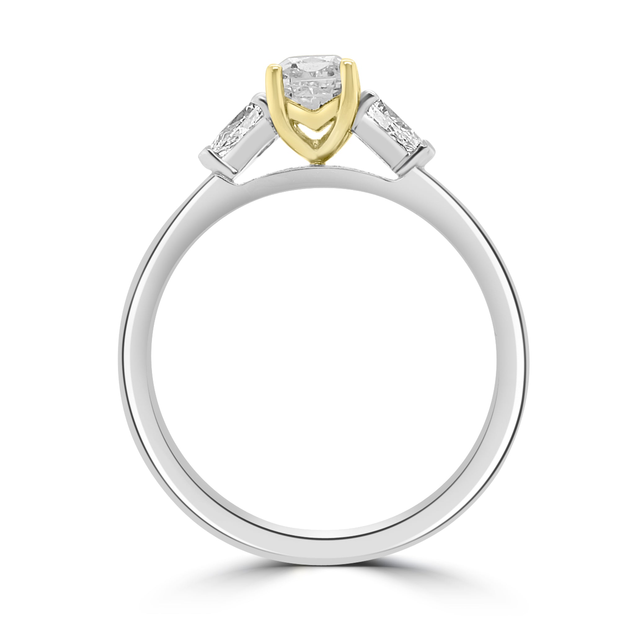 Close-up of radiant cut yellow diamond ring in platinum and yellow gold