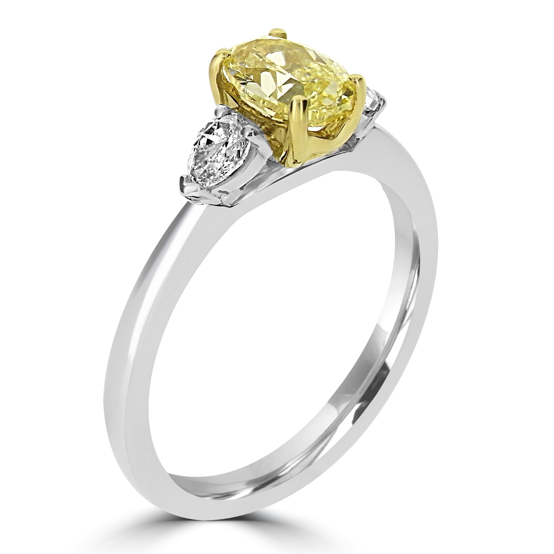 Ring with a yellow diamond and pear-shaped white diamond on a white background
