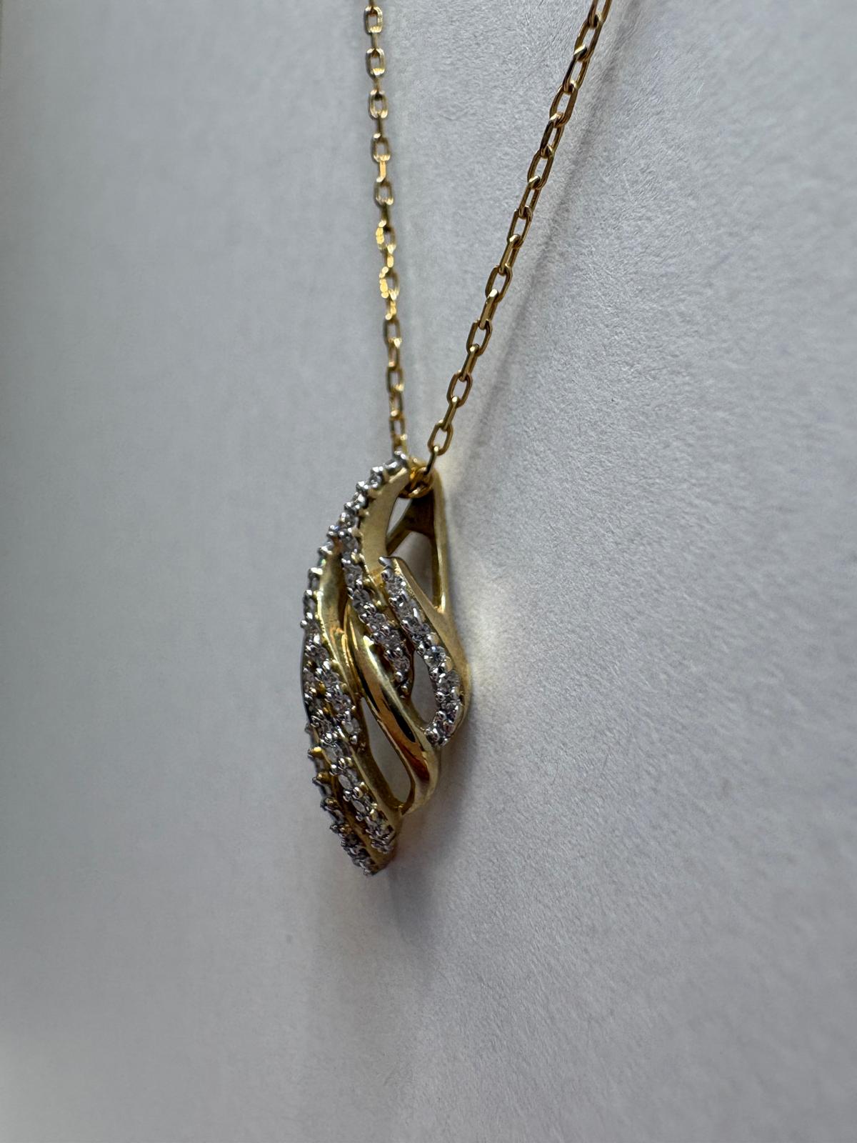 Harrogate jewellers diamond swirl pendant, pre-loved gold necklace, second hand 9ct gold pendant, diamond flame pendant UK, matching diamond jewellery set