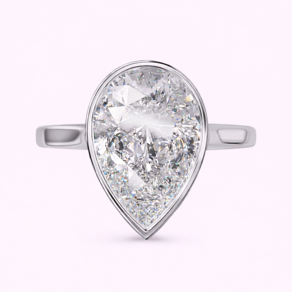 2.50ct pear shape lab-grown diamond bezel set engagement ring in yellow gold Fogal and Barnes Harrogate