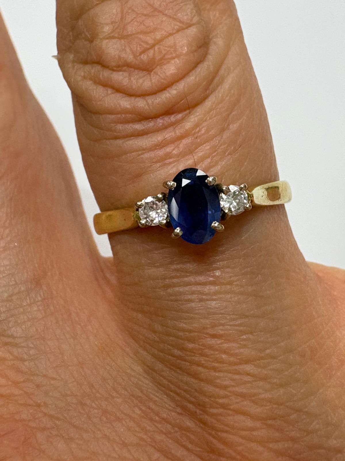 sapphire and diamond ring, three stone sapphire ring, 18ct gold sapphire ring, second hand sapphire ring UK, pre-loved sapphire ring, vintage sapphire ring, oval sapphire ring, September birthstone ring, sapphire trilogy ring, second hand jewellery Harrogate, second hand jewellery Leeds, second hand jewellery York, second hand jewellery Yorkshire, pre-owned sapphire ring UK,