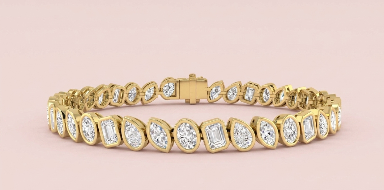 Lab grown multi-cut diamond tennis bracelet featuring 39 bezel set oval emerald pear and marquise diamonds totalling 8.50ct in yellow gold, shown on white background with CAD design detail