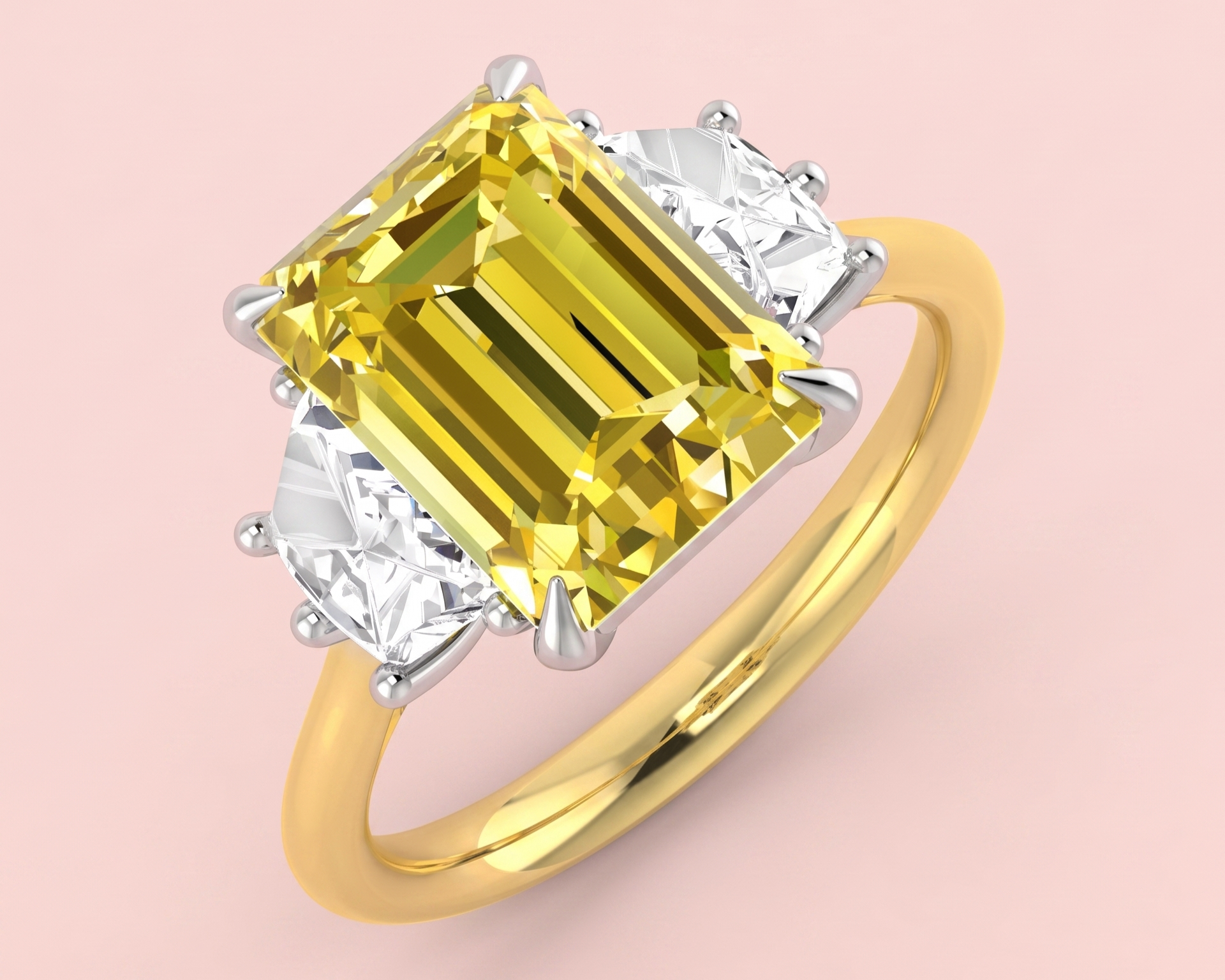 Lab grown yellow diamond three stone ring featuring a 3.56ct radiant cut centre stone flanked by two cadillac cut white diamonds totalling 0.82ct, shown in gold on pink background