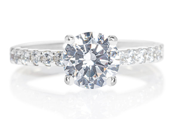 ROUND BRILLIANT CUT DIAMOND WITH DAINTY DIAMOND SHOULDERS ENGAGEMENT RING