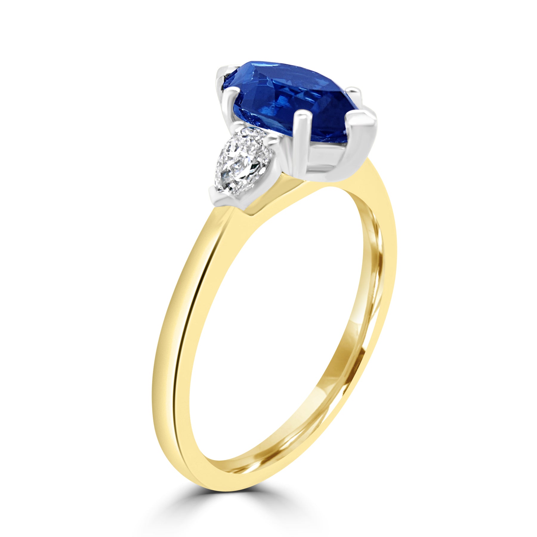 marquise cut sapphire, with pear diamonds engagement ring on 18k yellow gold from fogal and barnes fine jewellers of harrogate 