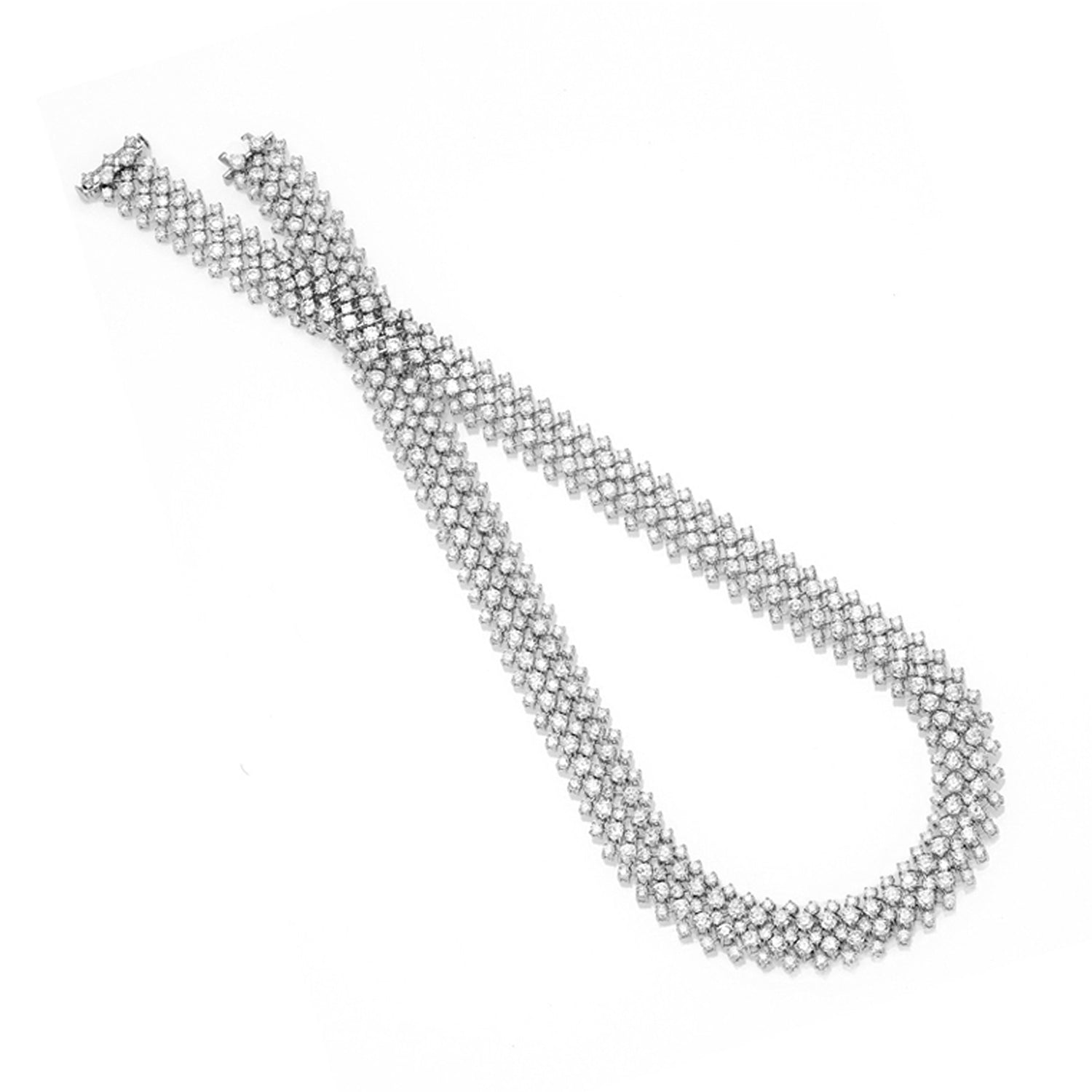 Wide multi-row white gold diamond cascade necklace featuring 628 round brilliant diamonds totalling 12.5ct, shown flat and draped on white background