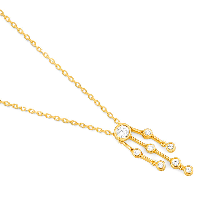 Yellow gold diamond raindance pendant necklace featuring a central bezel set diamond with three cascading gold bars tipped with round brilliant diamonds, on a 42cm chain,side