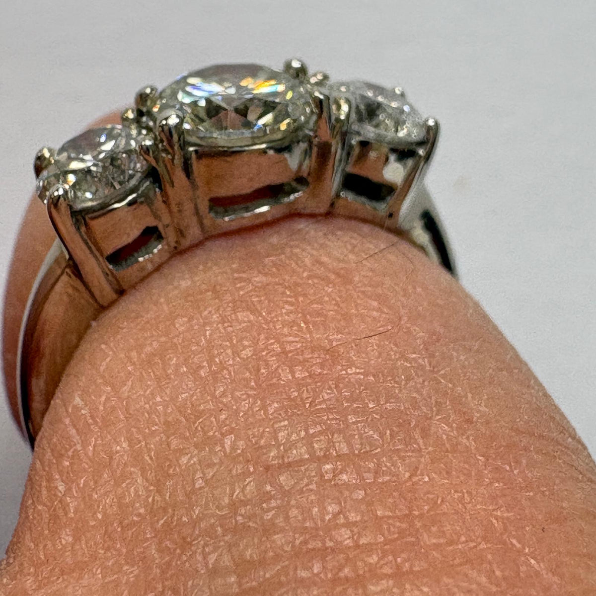 three stone diamond ring, trilogy diamond ring UK, platinum diamond ring, pre-loved engagement ring, second hand diamond ring, 1.5 carat diamond ring, anniversary diamond ring, pre-owned trilogy ring
