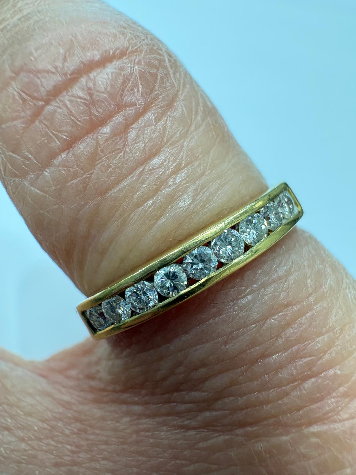 Profile view of pre-loved 18ct gold channel-set diamond band ring, size M