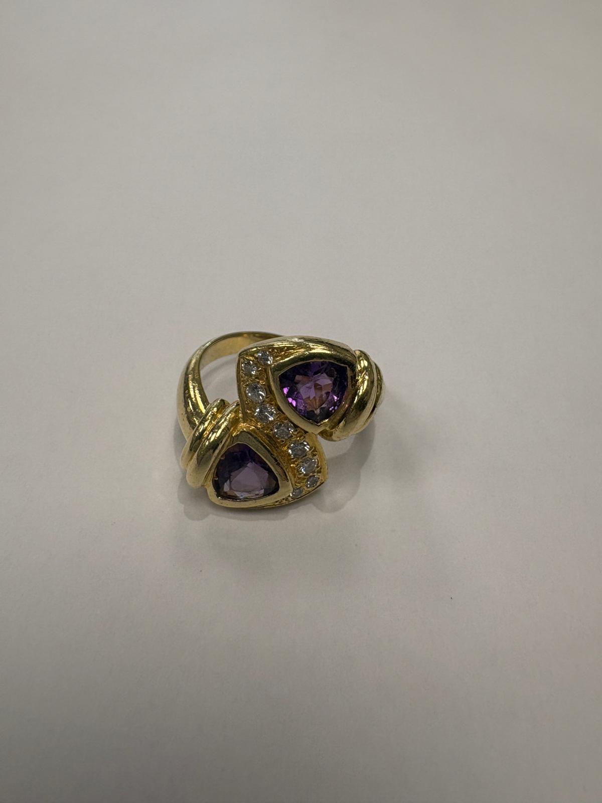 Pre-loved 18ct yellow gold natural amethyst and diamond toi et moi ring shown on hand, size N