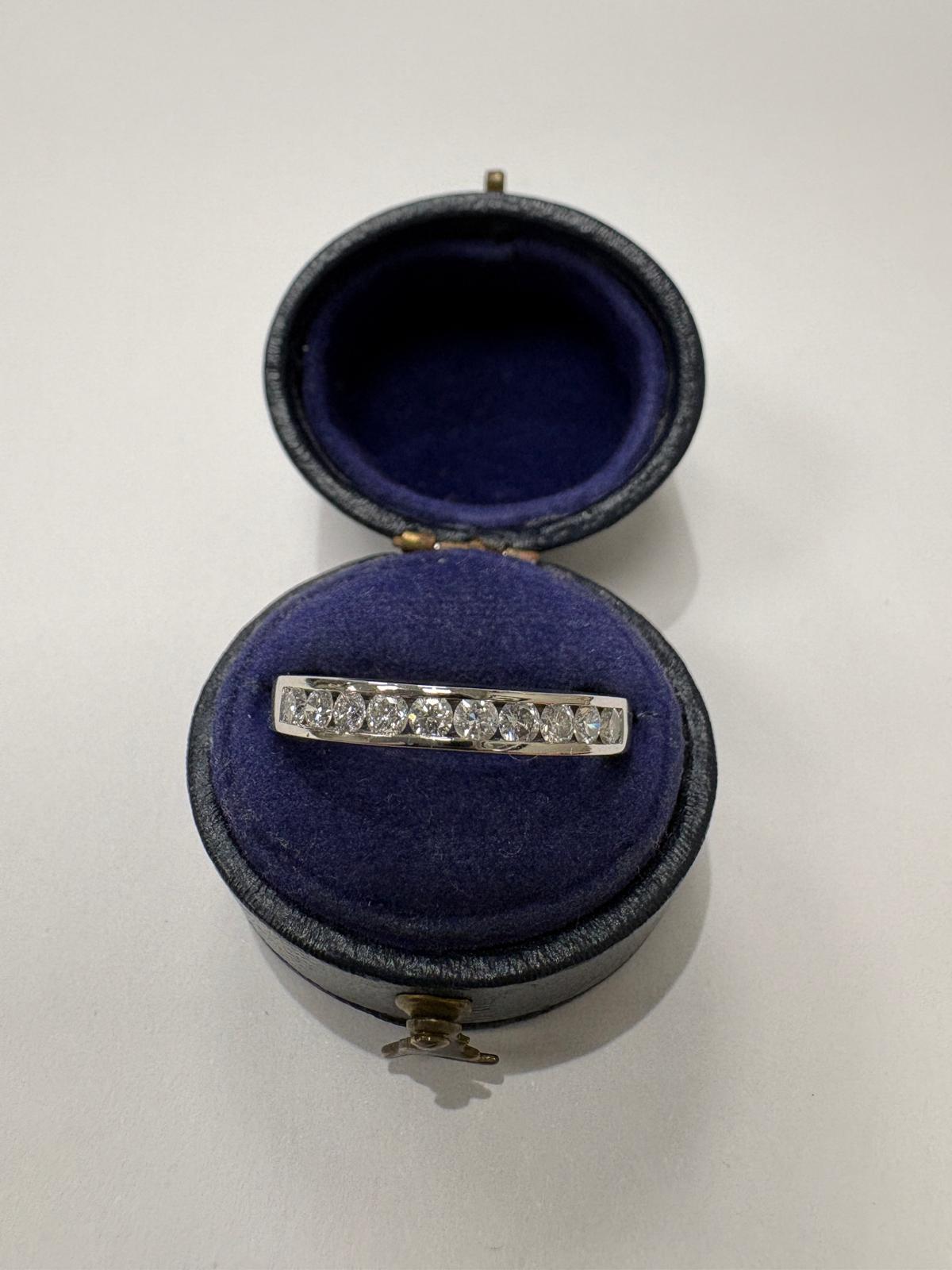 Pre-loved platinum channel-set natural diamond half eternity ring, Birmingham hallmarked 2003, size R