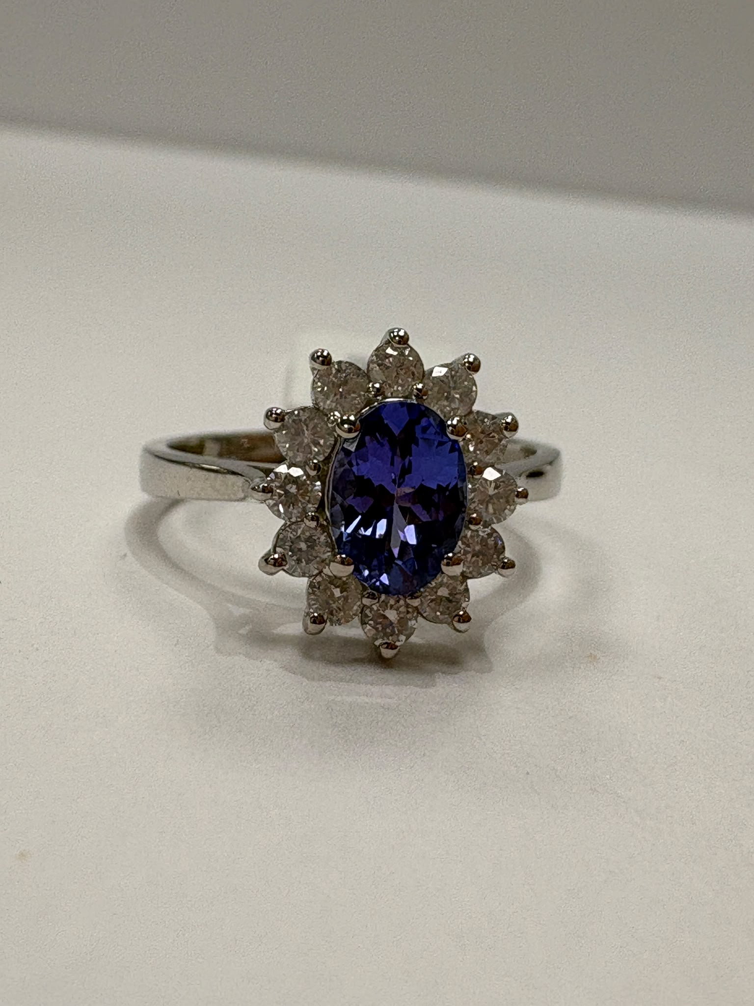 Tanzanite and diamond ring worn on hand, size M