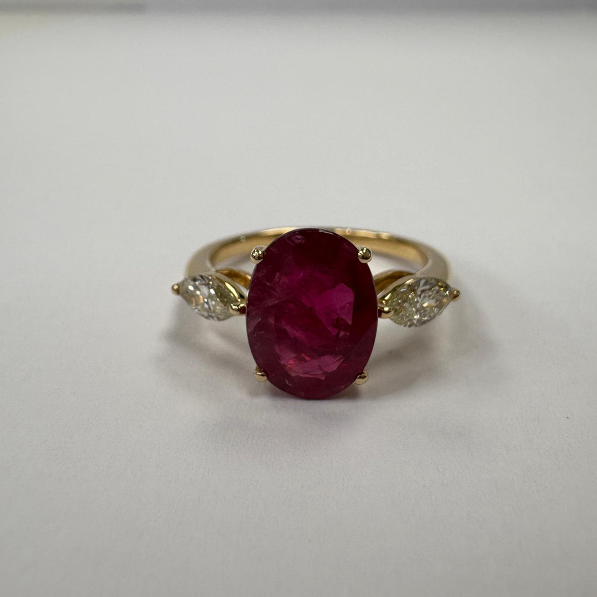 ruby and diamond ring, 3 carat ruby ring, oval ruby ring UK, marquise diamond ring, east west marquise ring, ruby engagement ring, ruby anniversary ring, 18ct gold ruby ring