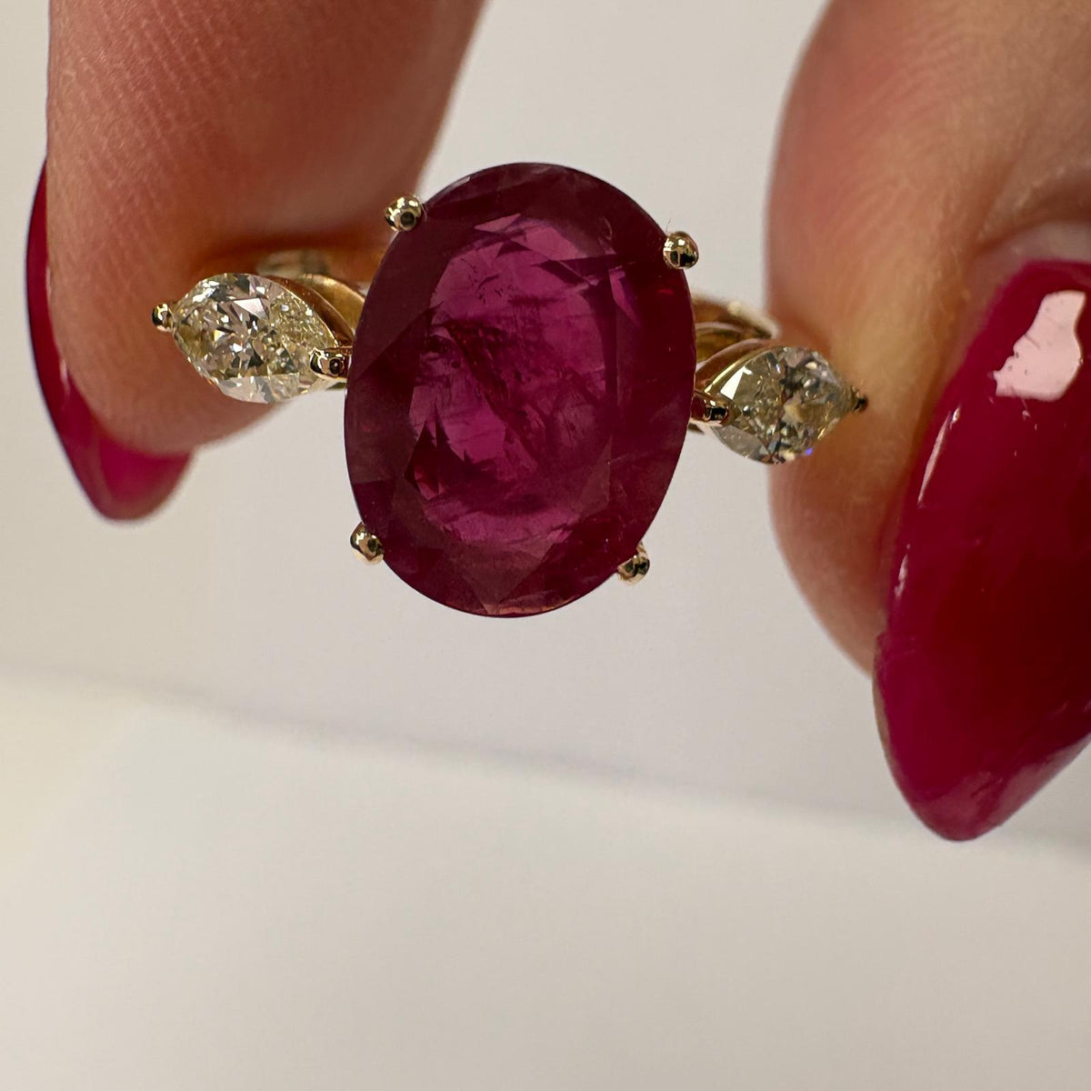 ruby and diamond ring, 3 carat ruby ring, oval ruby ring UK, marquise diamond ring, east west marquise ring, ruby engagement ring, ruby anniversary ring, 18ct gold ruby ring