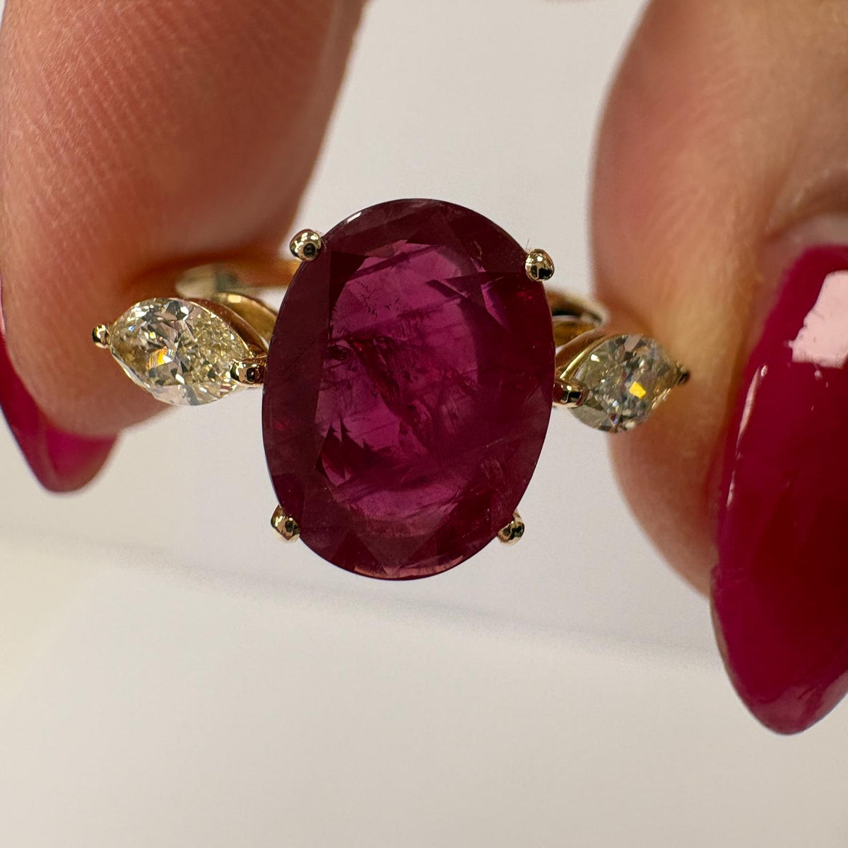 ruby and diamond ring, 3 carat ruby ring, oval ruby ring UK, marquise diamond ring, east west marquise ring, ruby engagement ring, ruby anniversary ring, 18ct gold ruby ring