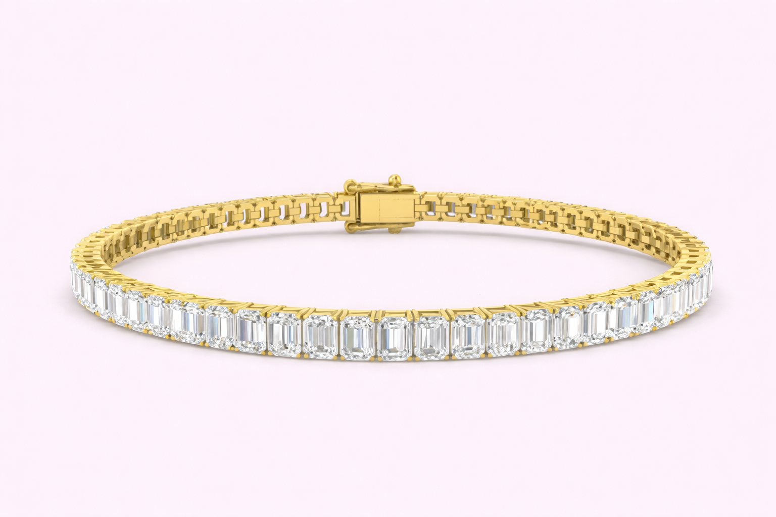 Lab-grown emerald cut diamond tennis bracelet 9.75ct set in yellow gold by Fogal and Barnes Harrogate jewellers