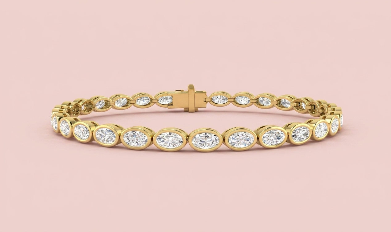 Lab grown east-west oval diamond tennis bracelet featuring 30 horizontally bezel set oval diamonds totalling 5.69ct, shown in white gold and yellow gold with CAD design detail