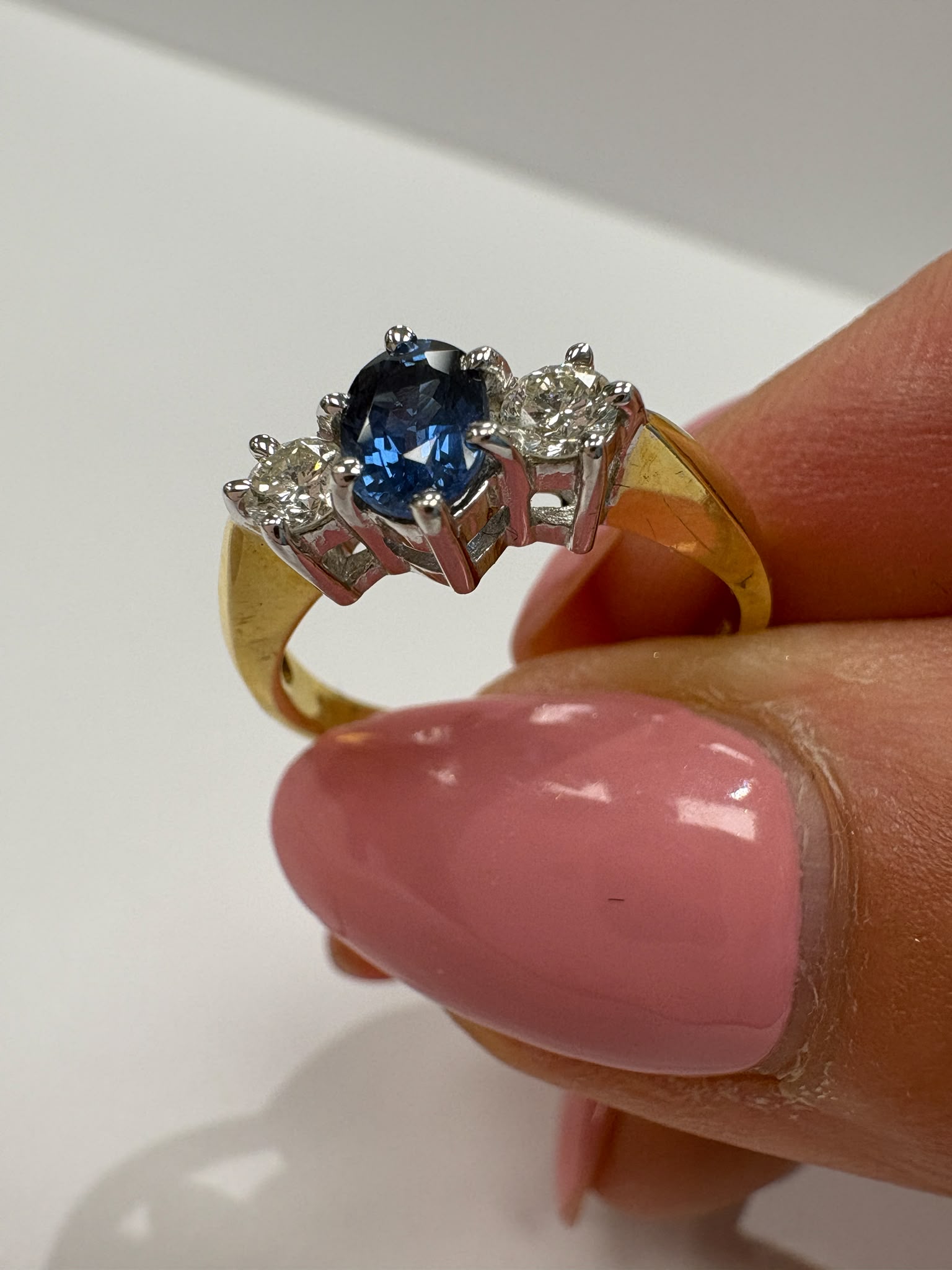 sapphire and diamond ring, three stone sapphire ring, 18ct gold sapphire ring, second hand sapphire ring UK, pre-loved sapphire ring, vintage sapphire ring, oval sapphire ring, September birthstone ring, sapphire trilogy ring, second hand jewellery Harrogate, second hand jewellery Leeds, second hand jewellery York, second hand jewellery Yorkshire, pre-owned sapphire ring UK, 18ct sapphire engagement ring, buy second hand sapphire ring, sapphire ring size L, sapphire ring near me, fine jewellery Harrogate, p