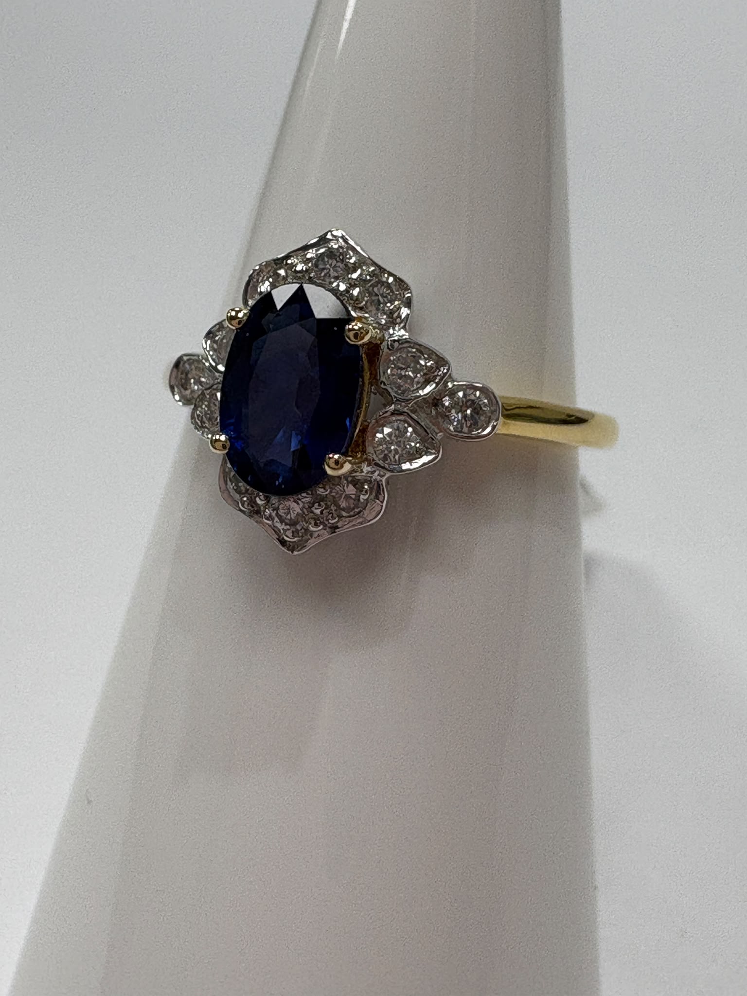 Oval cut sapphire and diamond vintage halo set on 18k yellow gold white head Harrogate jewellers secon hand jewellery engagement rings 