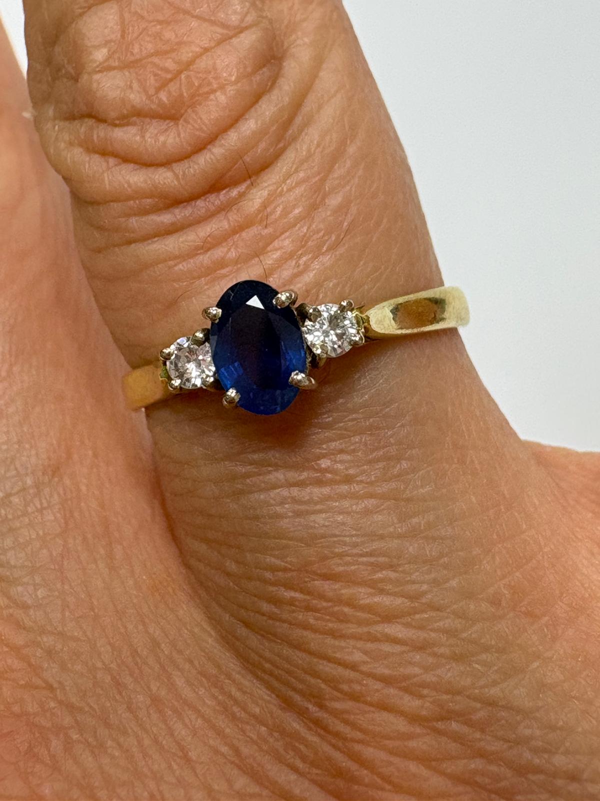 sapphire and diamond ring, three stone sapphire ring, 18ct gold sapphire ring, second hand sapphire ring UK, pre-loved sapphire ring, vintage sapphire ring, oval sapphire ring, September birthstone ring, sapphire trilogy ring, second hand jewellery Harrogate, second hand jewellery Leeds, second hand jewellery York, second hand jewellery Yorkshire, pre-owned sapphire ring UK,