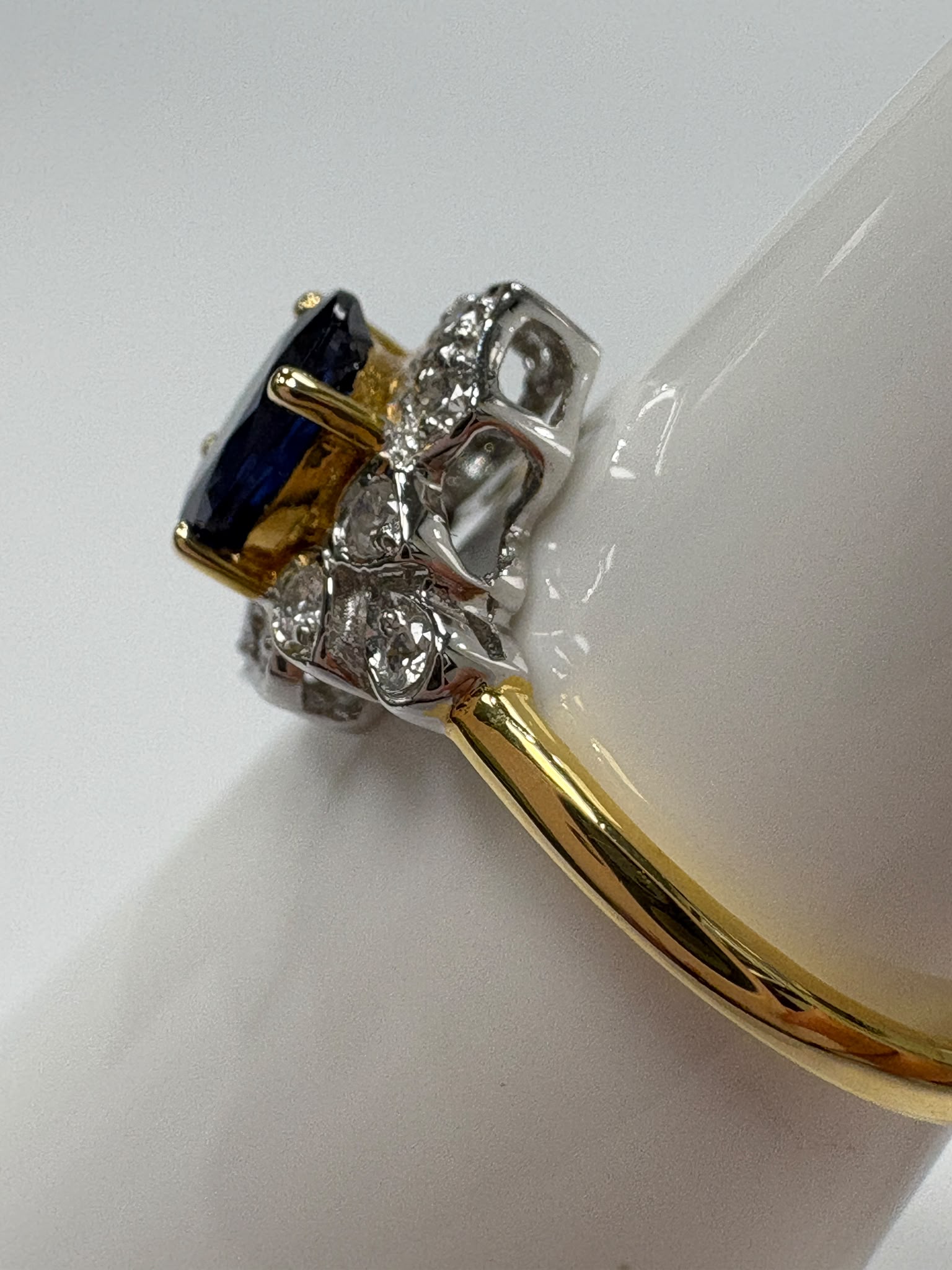 Oval sapphire and diamond halo vintage style engagement ring second hand piece harrogate jewellers