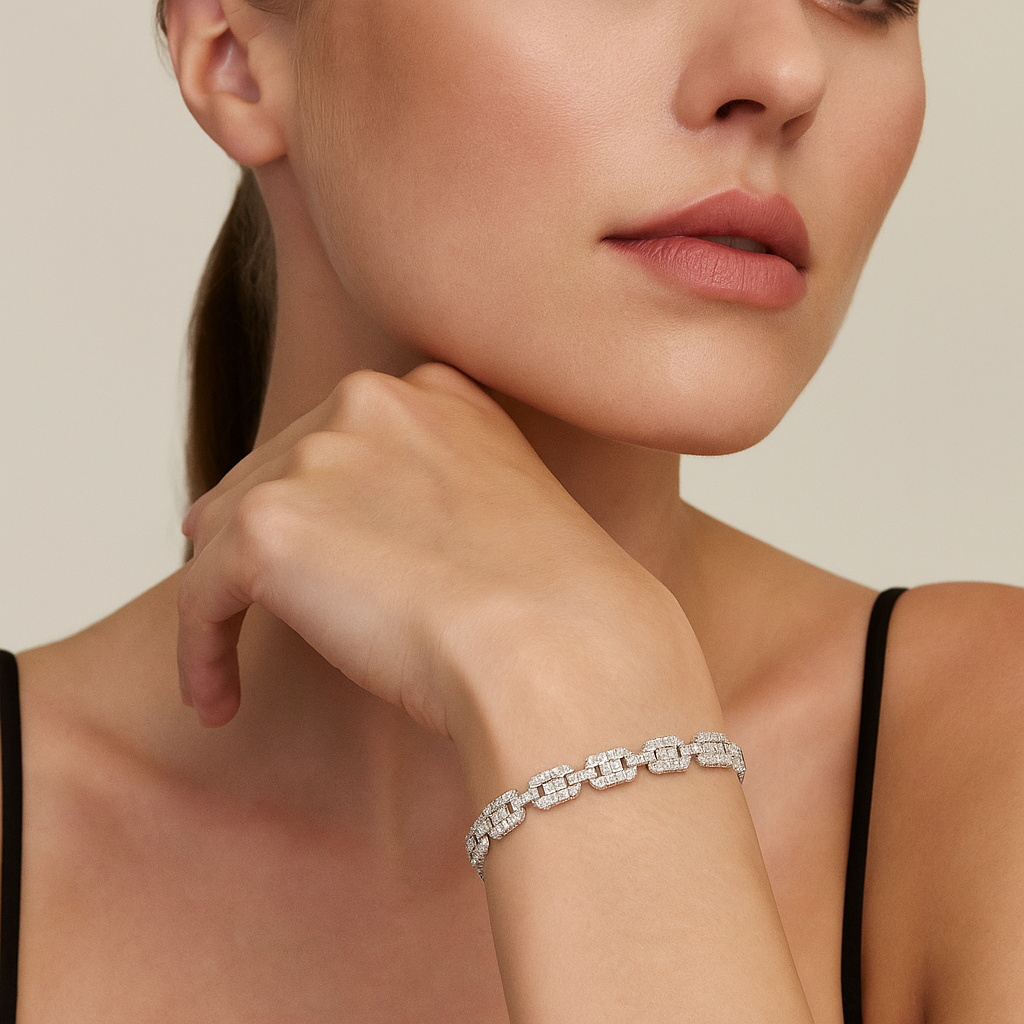 Close-up of a woman wearing a CZ bracelet on a neutral background