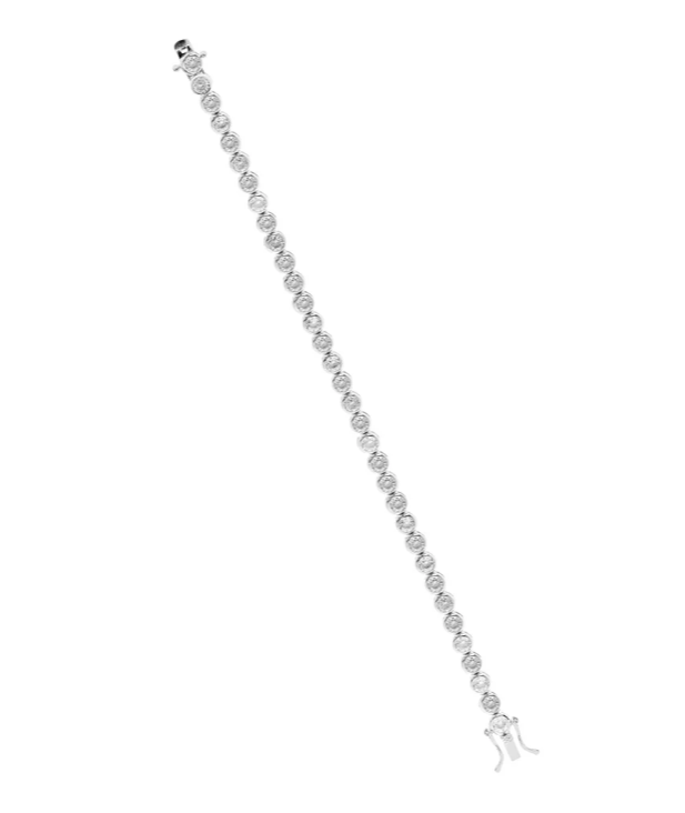 Sterling silver rubover set cubic zirconia tennis bracelet with polished finish.
