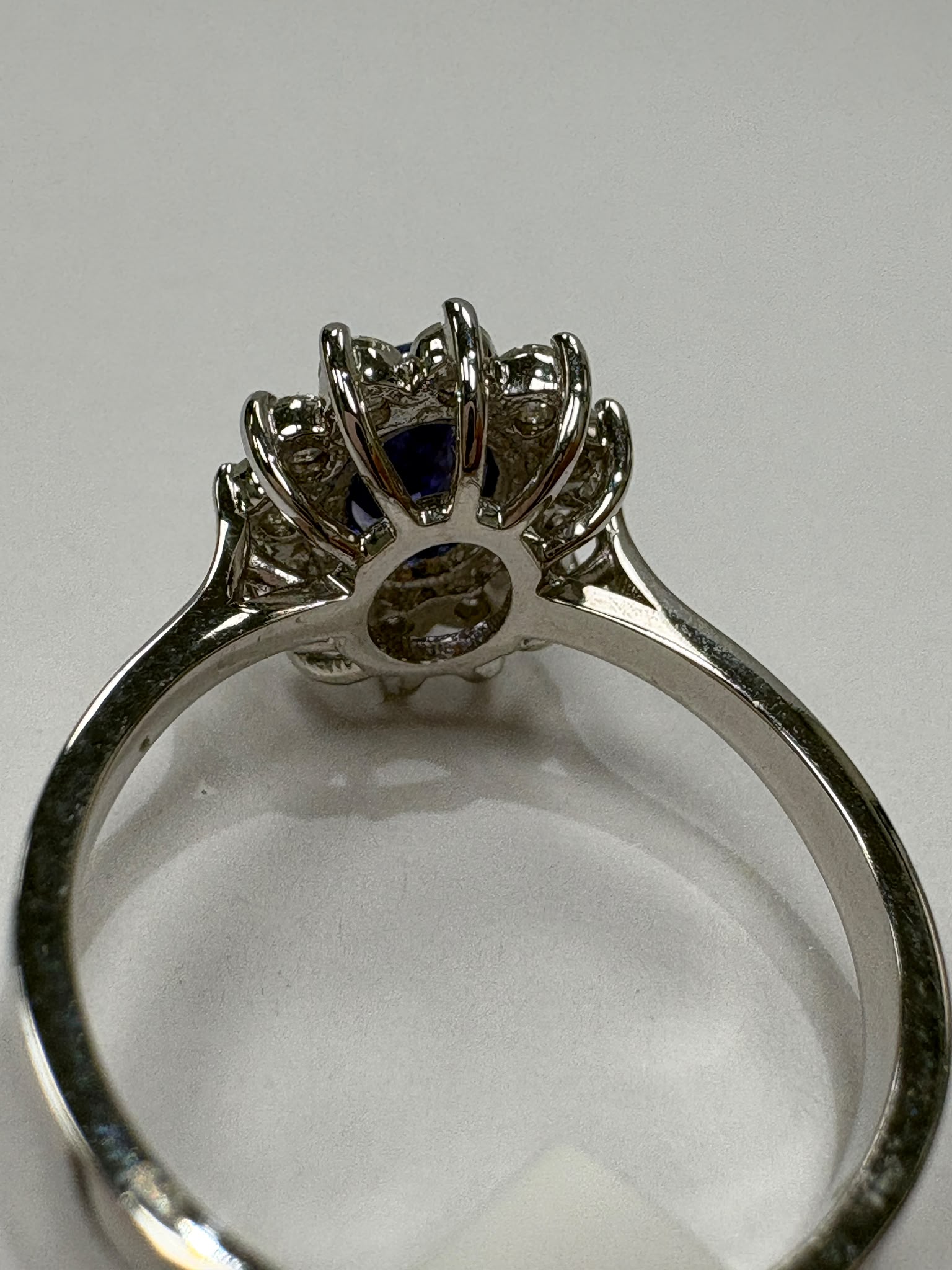 Close up of tanzanite diamond halo ring showing diamond detail