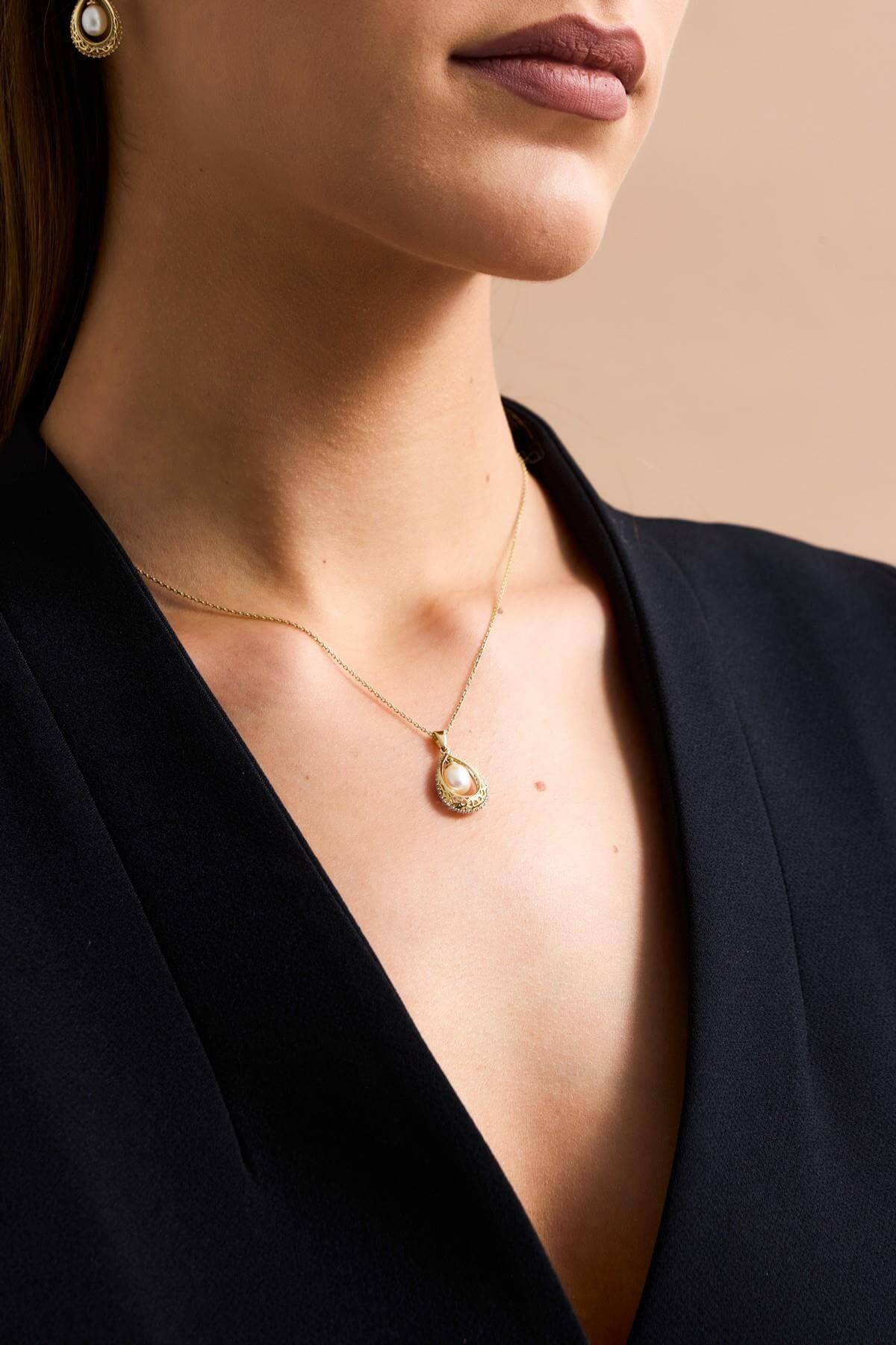 45cm 9ct yellow gold necklace with openwork drop pendant and 6mm natural pearl – available from Fogal and Barnes Fine Jewellers Harrogate.