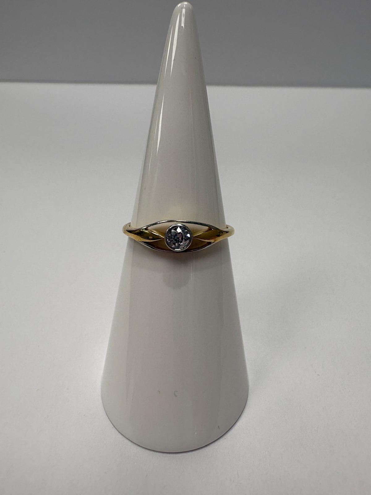 Vintage 9ct two tone yellow and white gold old cut diamond solitaire ring with open crossover shoulders, 0.15ct diamond, size N½, shown on ring cone and close up on white background, available at Fogal & Barnes Harrogate