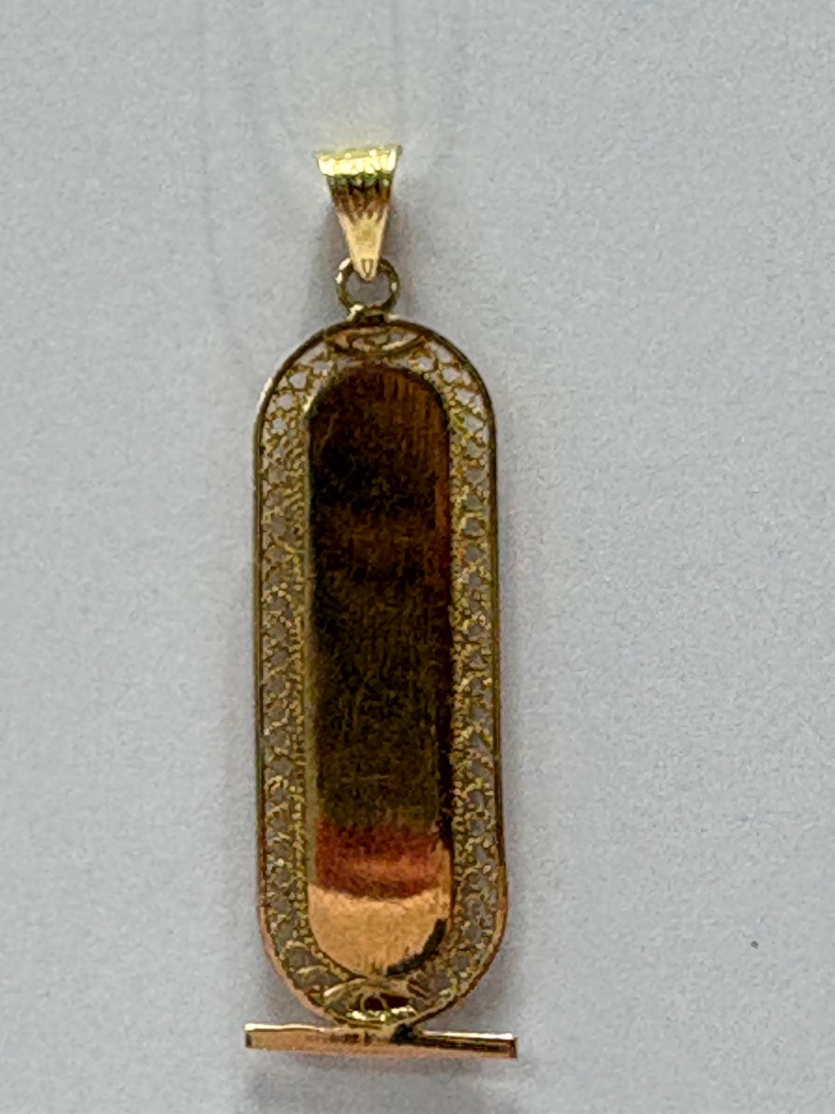 Vintage Egyptian 18ct yellow gold cartouche pendant with hieroglyphic engravings including ankh symbol and intricate filigree border, 3.96g, shown front and back and worn on neck, available at Fogal & Barnes Harrogat