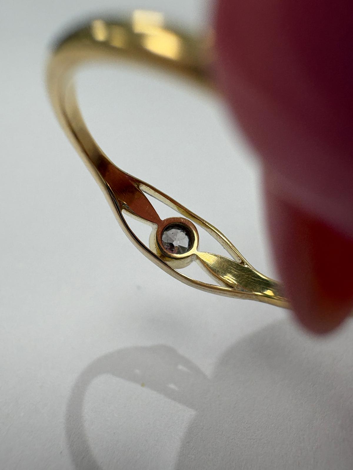 Vintage 9ct two tone yellow and white gold old cut diamond solitaire ring with open crossover shoulders, 0.15ct diamond, size N½, shown on ring cone and close up on white background, available at Fogal & Barnes Harrogate