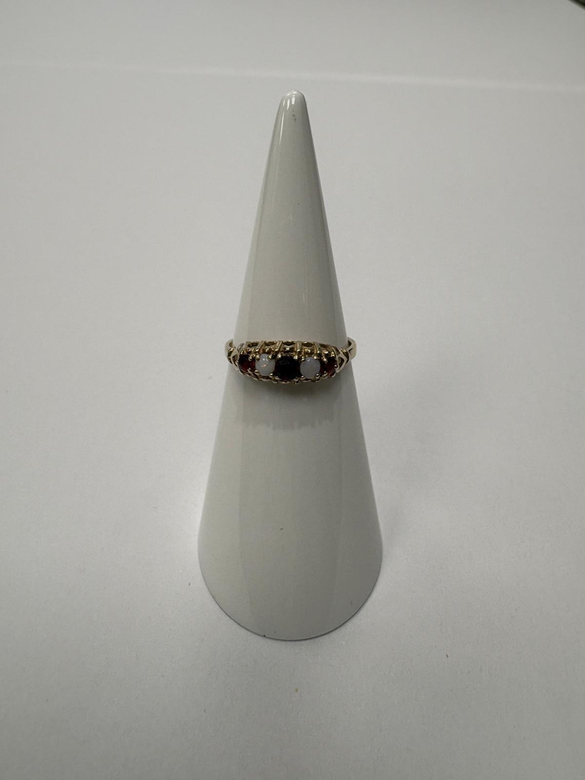 Vintage 9ct gold garnet and opal five stone ring in a Victorian style carved gallery