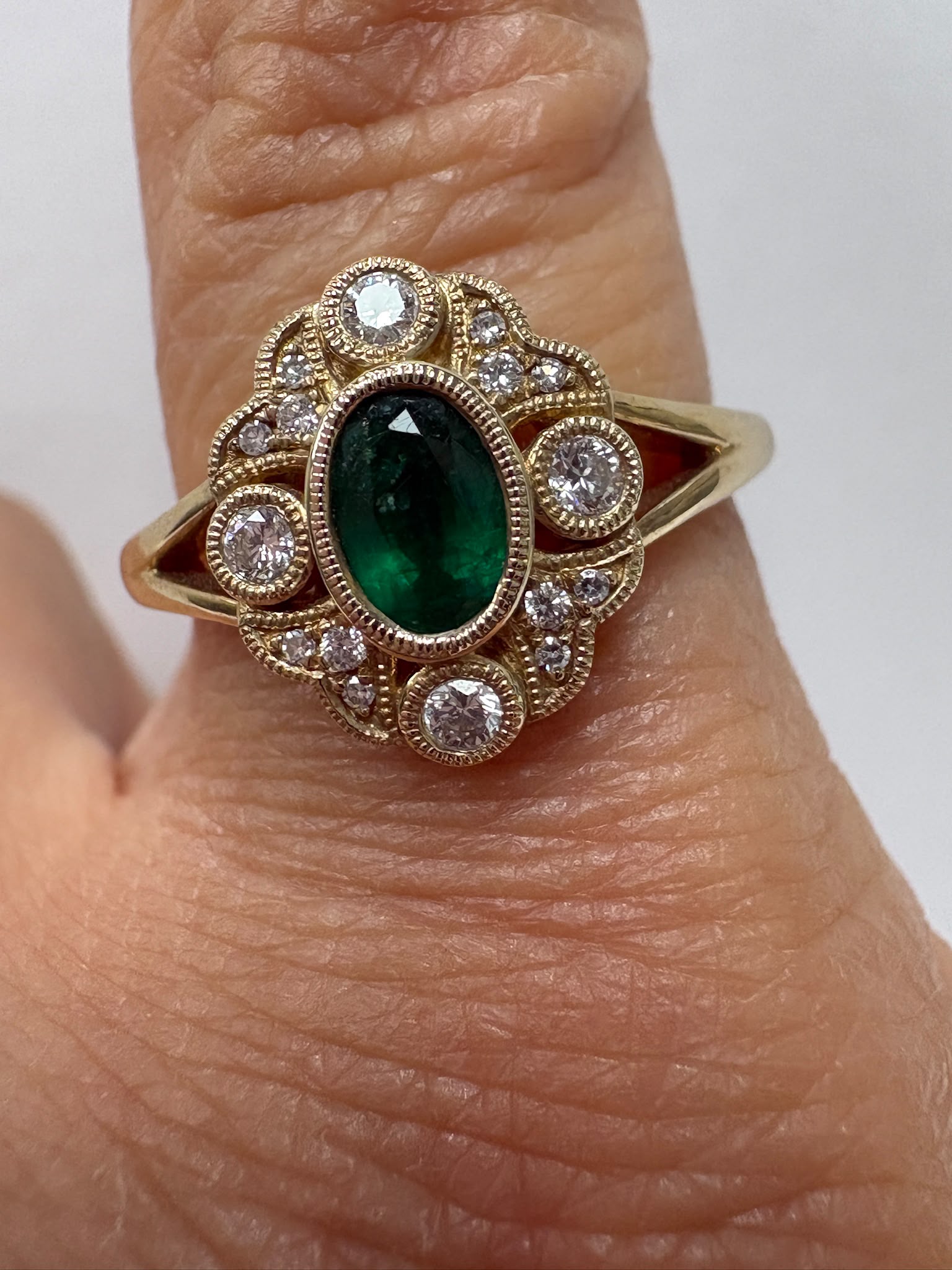 Vintage-style emerald and diamond milgrain cluster ring, 9ct gold, size N. Pre-loved, authenticated. Shop coloured gemstone jewellery in Harrogate.