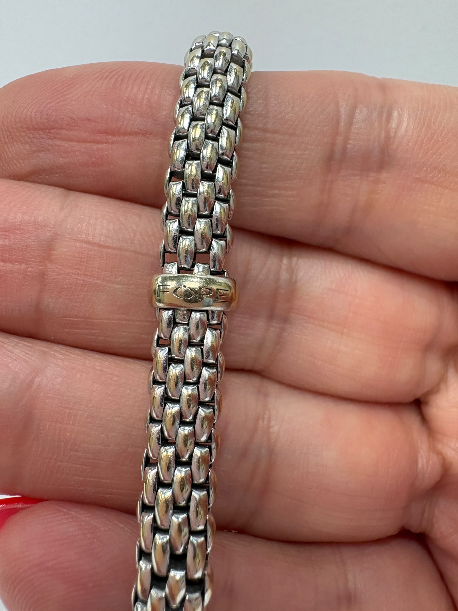 18ct white gold FOPE Flex'it mesh bracelet showing logo tag, pre-loved jewellery Harrogate