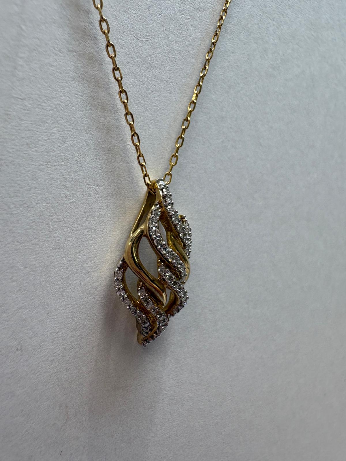 diamond swirl pendant, pre-loved gold necklace, second hand 9ct gold pendant, diamond flame pendant UK, matching diamond jewellery set jewellers york 