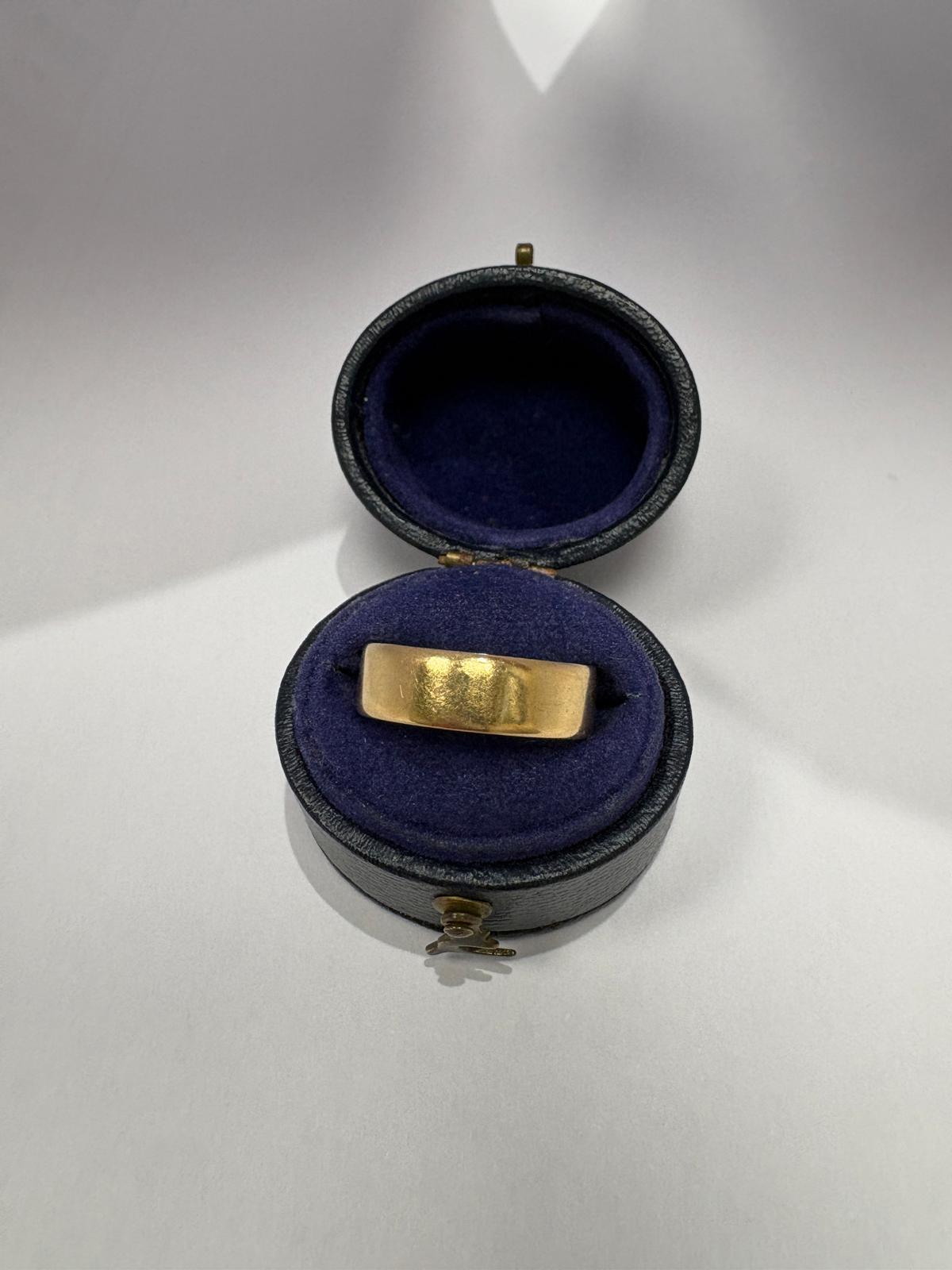 British antique hallmarks on 22ct yellow gold wedding band — maker JFP, sovereign's head, crown and 916