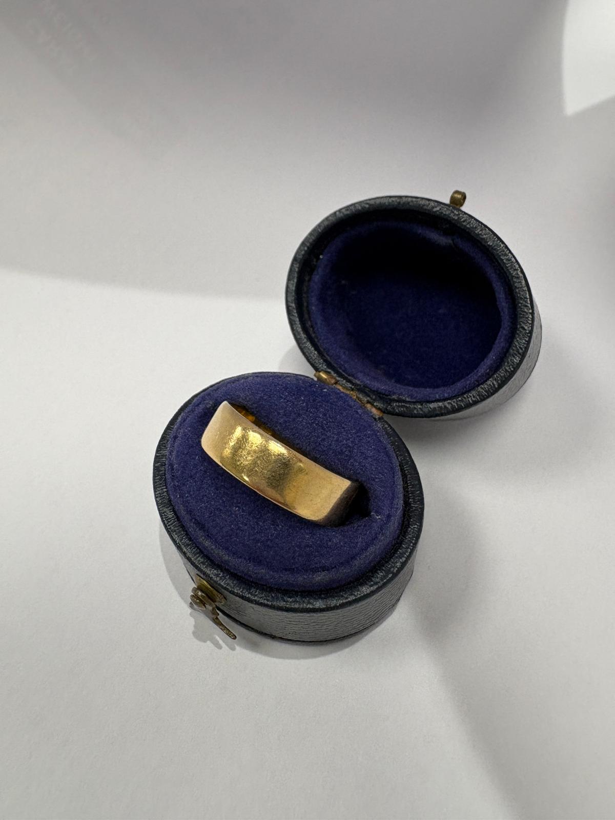 Profile view of antique 22ct yellow gold wide plain wedding band, size N