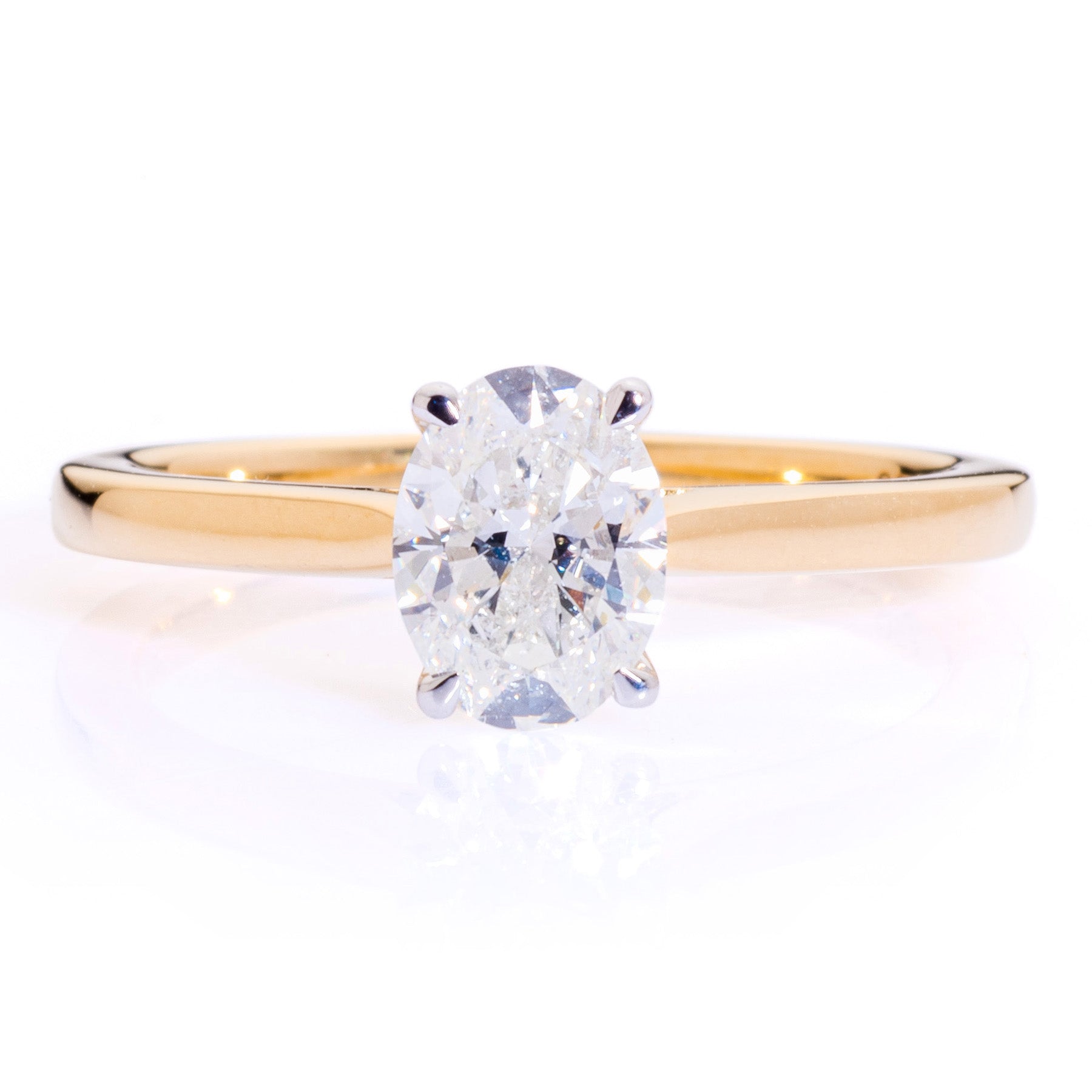 Oval diamond solitaire platinum claw yellow gold tapered band Harrogate jewellers Fogal and barnes 