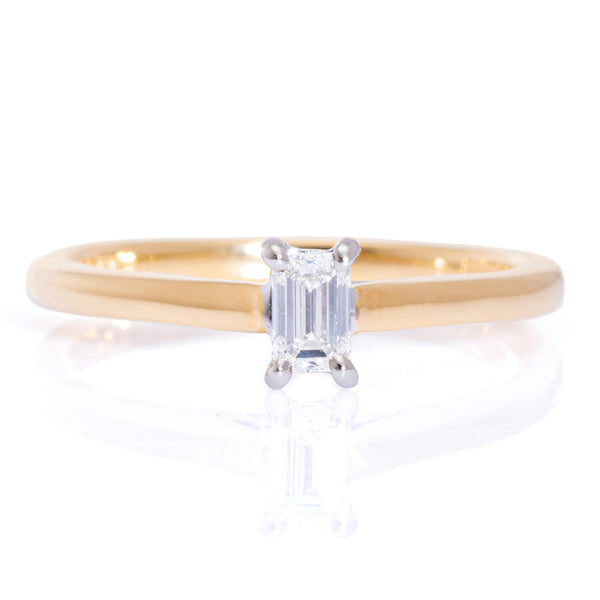 emerald cut diamond solitaire engagement ring  set in platinum with a yellow gold band harrogate jewellers fogal and barnes