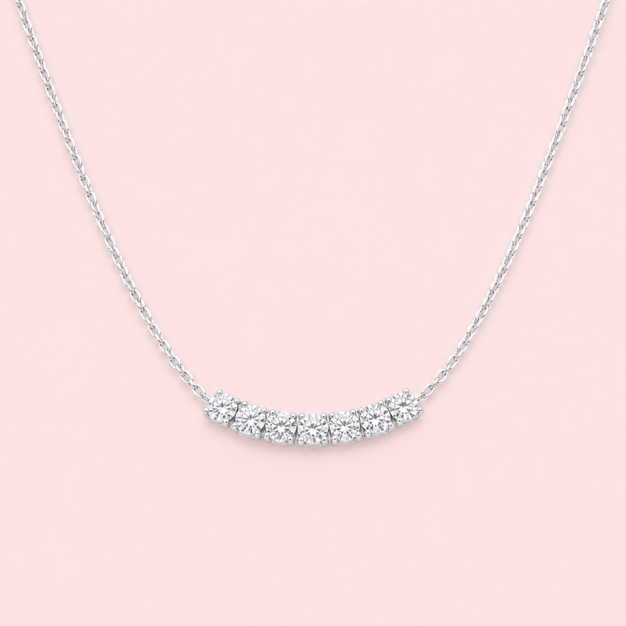 Lab-grown diamond curved bar necklace in 18ct white gold, seven round brilliant F VS diamonds, 1.20ct total, made to order at Fogal & Barnes Harrogate